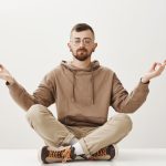 A man seated in meditation