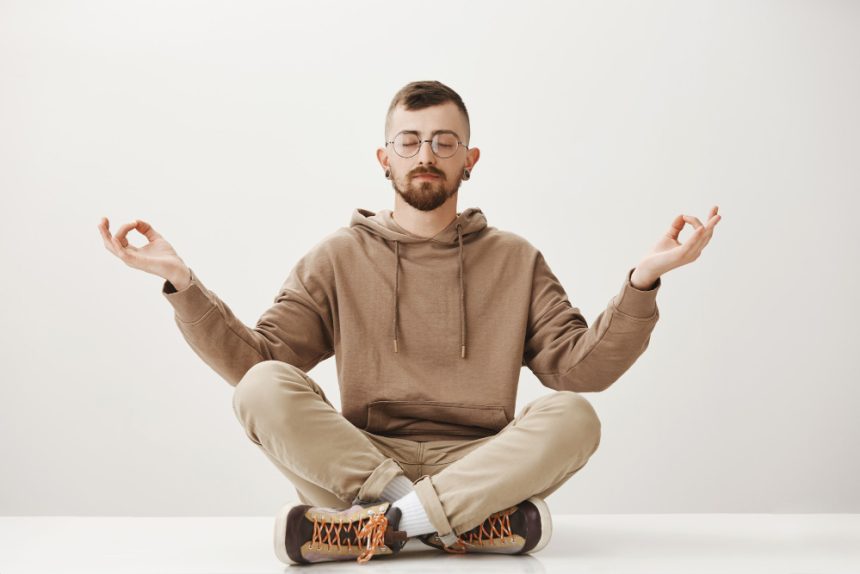 A man seated in meditation