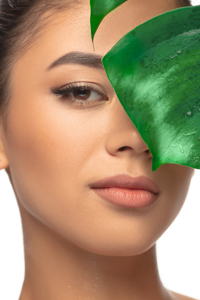 A lady with enhanced facial skin due to green products.