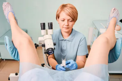 A woman undergoes colposcopy examination.